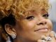 Rihanna attending Grammys alone a year after Chris Brown assault. Brown busy working on Greatist Hits album.